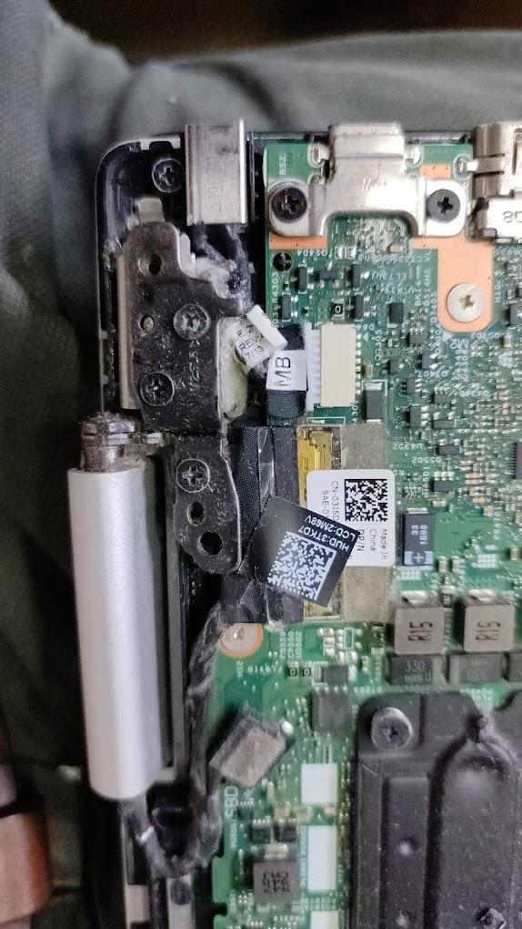 Huawei laptop motherboard and hinge assembly opened for repair